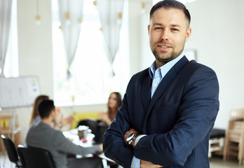 Handsome smiling confident businessman portrait