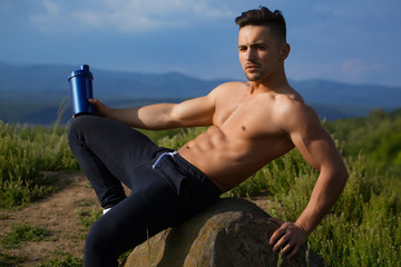 Naklejka na ściany i meble muscular man with water bottle