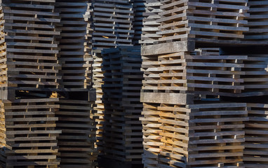 Oak planks for wine barrels stacked in piles elution of tannins on the open air
