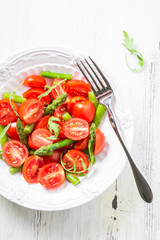 Fresh salad with cherry tomatoes and asparagus