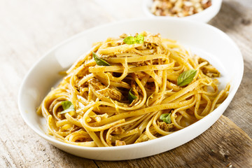 Pasta with spicy chicken, lemon and nuts
