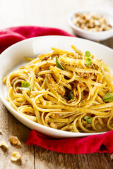 Pasta with spicy chicken, lemon and nuts