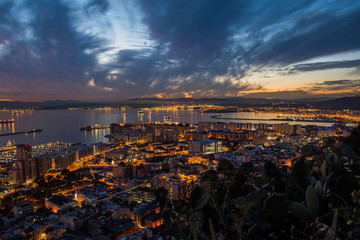 Mediterranean Sea, Gibraltar and South Spain city lights seen in the evening from Rock of Gibraltar