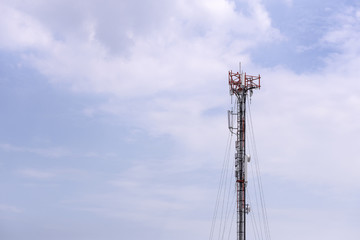 Antenna tower,antenna tower building with the blue sky.Close-up of the antenna building with the sky background.Communication antenna tower with the sky background in close-up scene.