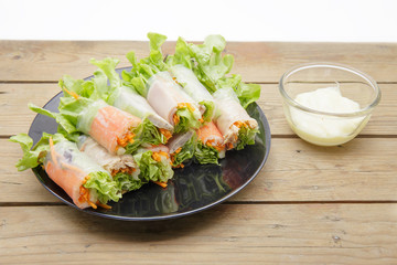 Salad roll in dish.