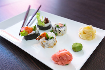 Sushi set with chopsticks on the plate