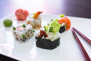 Sushi set with chopsticks on the plate