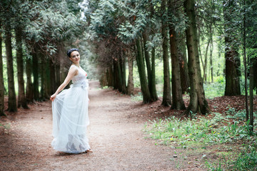 bride, girl in white dress in the park