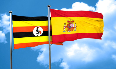 Uganda flag with Spain flag, 3D rendering