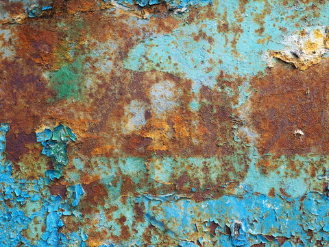 Iron sheet surface with rust stains and old painting on it with copy space © asadykov