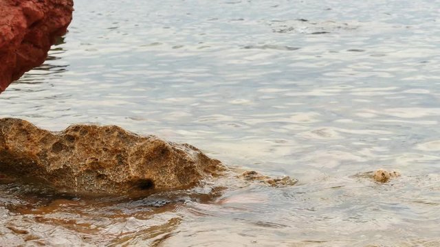 Malta natural rocks in a coastline - smooth follow focus starts from afar