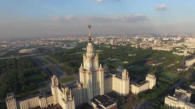 Helicopter flight over MSU Moscow State University. Close approach to star. Moscow city center and Luzhniki stadium at background. Ultra HD 4K. Best footage.