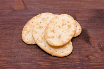Some crackers oval on a wooden table