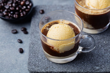 Affogato coffee with ice cream on a glass cup Grey slate background