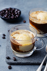 Affogato coffee with ice cream on a glass cup Grey slate background