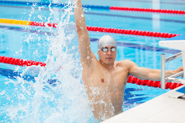 Winning Swimmer Young muscular preparing