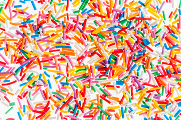Fototapeta na wymiar Colorful candy sprinkles isolated on white background card