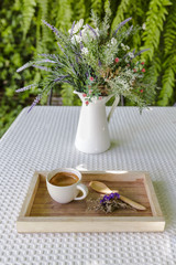 Coffee and spring flowers on wooden tray, Espresso coffee in wooden tray
