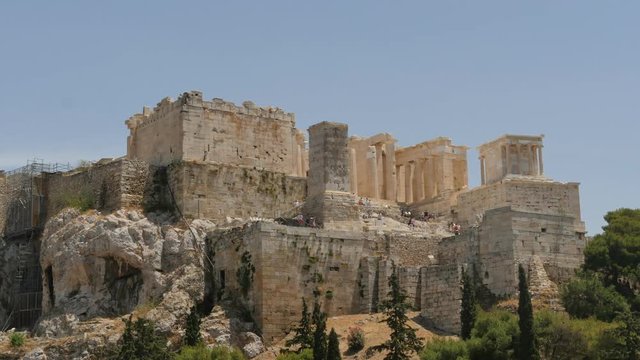 Acropolis in Athens of Greece with tourist afar - time lapse