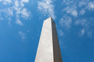 Obelisk column marble blue sky clouds