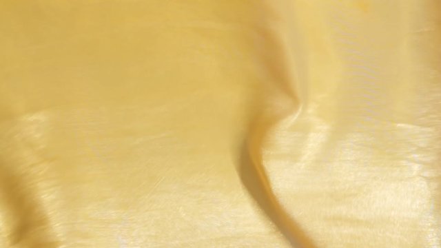  yellow cloth lye swaying in the wind, closeup