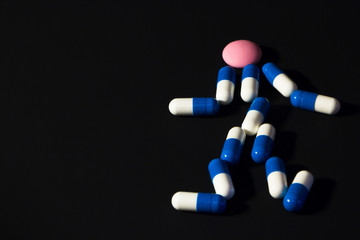 human figure made of pills