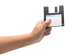 One human hand holding a black 3.5 inch manetic diskette isolate
