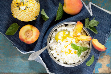 Homemade cheese, honey and fresh peaches, healthy food, cooking