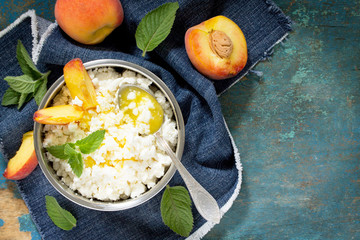 Homemade cheese, honey and fresh peaches, healthy food, cooking