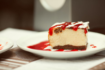 Tasty morning cafe. Slice of cheese cake with sugar powder & jam