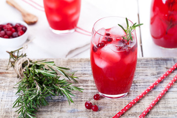 Cranberry and rosemary lemonade, cocktail, fizz on a wooden background