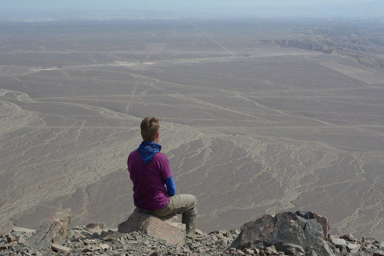 Person and landscape of nazca lines