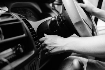 Right hand drive car, UK. turning on ignition, background dashboard, closeup