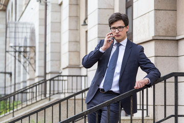 Young handsome businessman on phone