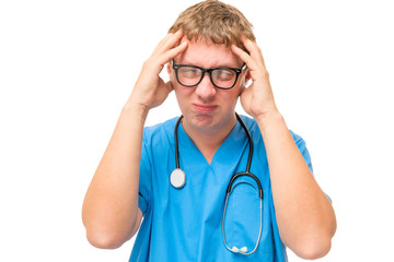 doctor holding hands aching head on a white background isolated