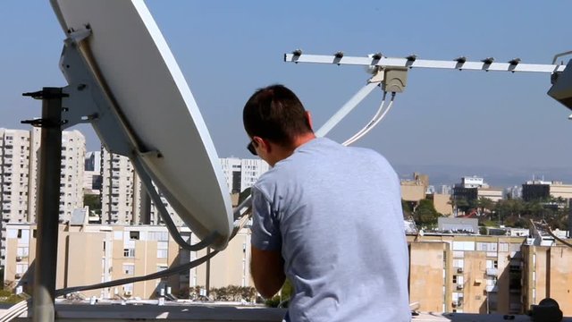 Technician fixing of receiving device of satellite dish