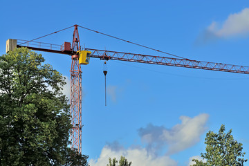 Construction crane against the blue sky