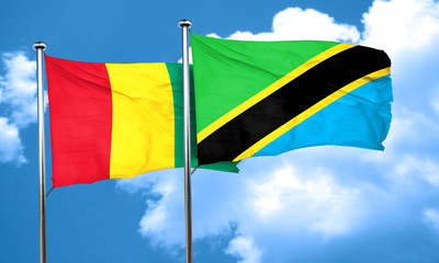 Guinea flag with Tanzania flag, 3D rendering