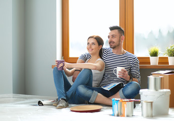 Portrait of young couple moving in new home