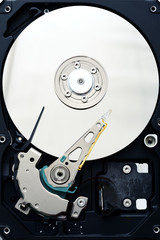 Disassembled computer hard disk drive internals inside close up, view from the top