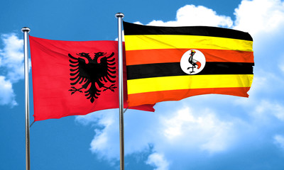 Albania flag with Uganda flag, 3D rendering