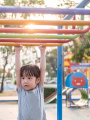 Happy kid, asian baby child playing on playground