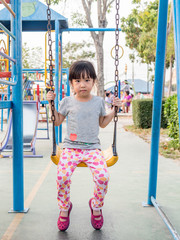 Happy kid, asian baby child playing on playground