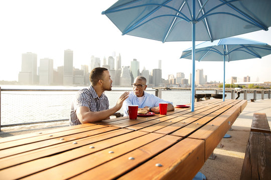 Two men having picnic in Brooklyn
