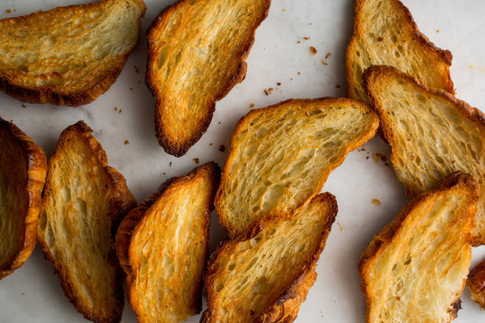 Baked croissants on work surface