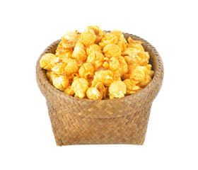 popcorn in basket on white background