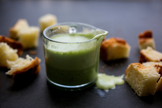 Green liquid in small measuring jug