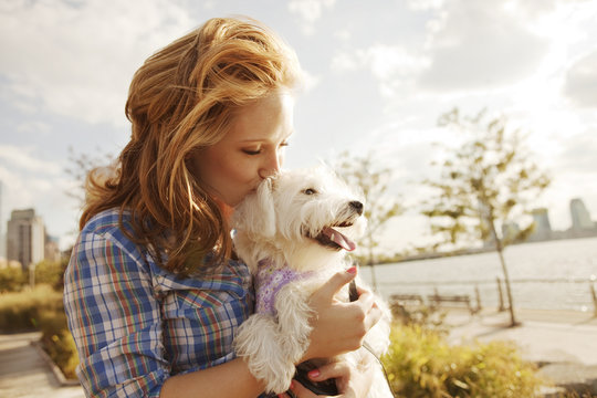 Woman Kissing Her Dog