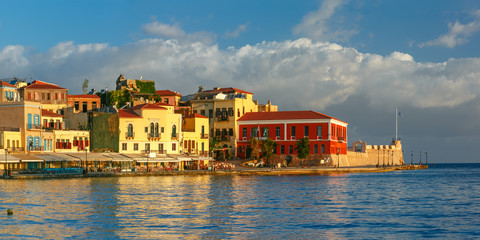 Fototapeta na wymiar Picturesque panoramic view of old harbour, Firkas Fortress and Venetian quay of Chania in the morning, Crete, Greece