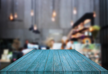Blue table top wooden with blurred background in coffee shop